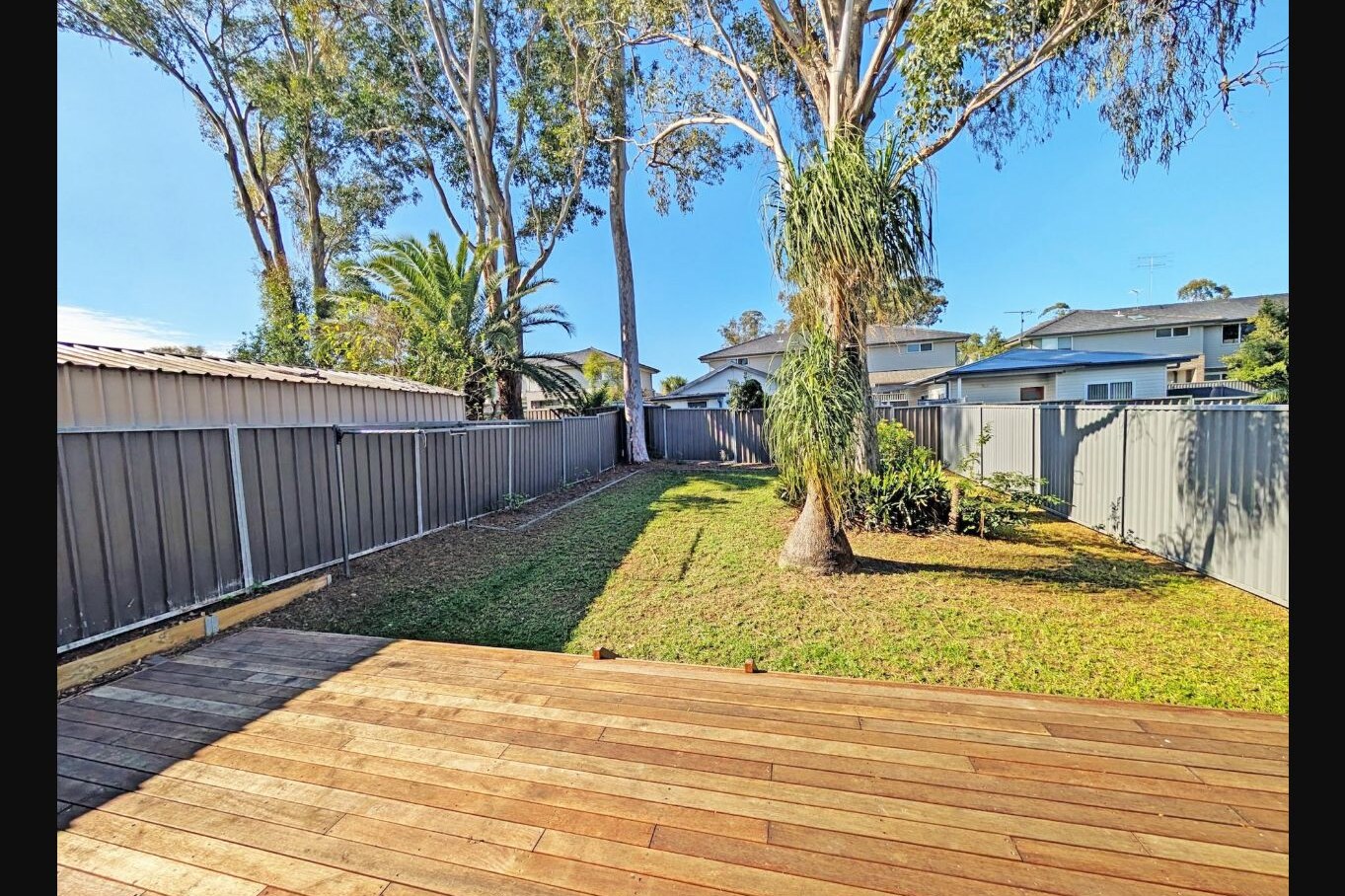 Timber entertaining deck and fenced backyard